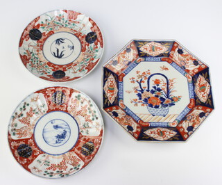 A Japanese octagonal Imari plate decorated a basket of flowers 27cm (chip to rim) together with 2 circular Japanese Imari plates with panel decoration 22cm 