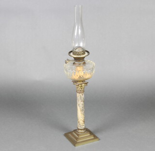 A Victorian faceted clear glass oil lamp reservoir raised on a gilt metal and marble effect column with corinthian column capital and etched glass shade 45cm h x 14.5cm w x 15cm d 
