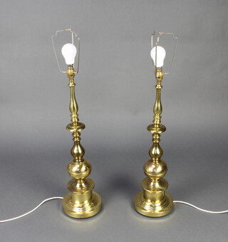 A pair of large and impressive gilt metal table lamps 67cm h x 19cm 