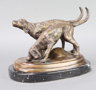 A 20th Century bronze figure group of two standing hounds raised on an oval black marble base 29cm x 19cm 