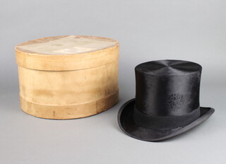 A gentleman's black silk top hat by W A Smalley of Nottingham, size 7 1/4, complete with hat box  