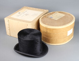 A gentleman's black silk top hat by Samuel Mortlock and Sons of London size 6 7/8, together with a square Herbert Johnson hat box and an oval N Wild and Sons hatbox 
