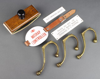 Three brass London South Western Railway hat and coat hooks, a Southern Railways oak desk blotter, a British Railways enamel Mishap Controller armband, 2 rectangular plastic carriage signs - Not drinking water and Please do not use lavatory when train is standing in station 