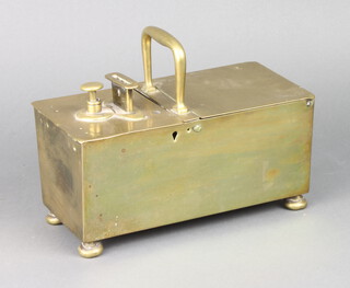 A 19th Century rectangular brass tobacco honour box with hinged lid, raised on on bun feet 12cm x 24cm x 12cm 
