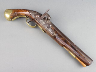 An 18th/19th Century percussion pistol with 23cm circular barrel, the lock with queens crown, having brass mounts and ram rod 