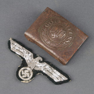 A Second World War Nazi German cloth eagle badge together with a belt buckle marked Gott Mit Uns  