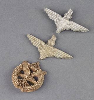 Two Second World War plastic Parachute Regiment cap badges together with a ditto Army Air Corps 