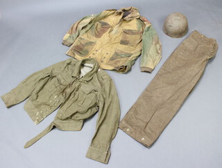 A 1942 Captain's Denison (Airborne Troops) smock size 2, dated 1942 and marked Skaife, WD7 with broad arrow, together with a steel helmet complete with liner, the leather liner marked BMB 1943 7 1/3 together with a pair of Denison trousers no.2 size 8, dated 1939 and a lightweight battle dress blouse (some paint stains) 