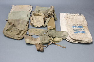 A quantity of various Second World War military webbing relating to Captain J Skaife D'Ingerthorpe comprising pair of puttis (some moth), 3 pairs of gaiters, 3 webbing belts, 2 ammunition pouches, a map case dated 1944, webbing collapsible bowl, respirator case, 5 webbing bags, webbing housewife (no contents) and 2 canvas kit bags 
