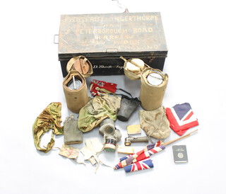 A metal uniform trunk marked J D Skaife D'Ingerthorpe containing 2 Second World War Thermos food flasks, a civil defence respirator, a civilian respirator, water bottle, flags etc 