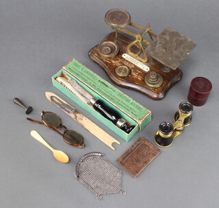 A pair of postal scales complete with weights, a pair of gilt and tortoise shell opera glasses (chip to rim), a Saquis Lawrence's knitting machine, a horn spoon and other curios 