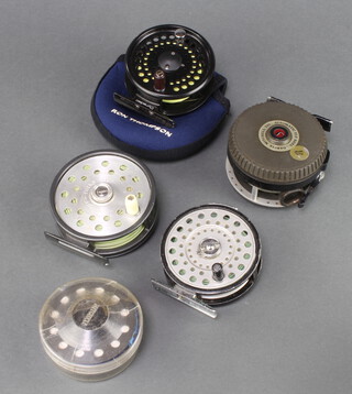 A Mitchell Automatic 710 fly fishing reel with spare spool, a Daiwa 710 fly reel and a Ron Thompson Dynadisc 6/7 fly reel and 1 other 