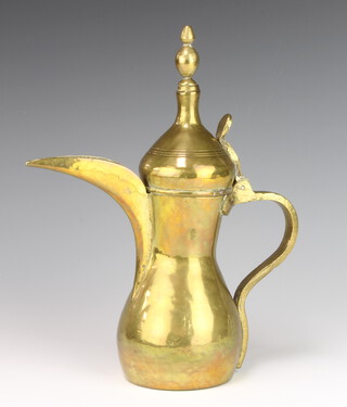 A Turkish brass coffee pot, having a heart shaped stamp to both sides of the main body 31cm h 
