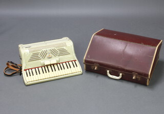 An Ariston piano accordion with 120 bass buttons, 2 treble couplers and 41 keys, cased