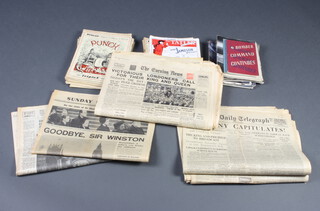 A collection of newspapers relating to World War Two and various editions of Punch and other magazines etc 