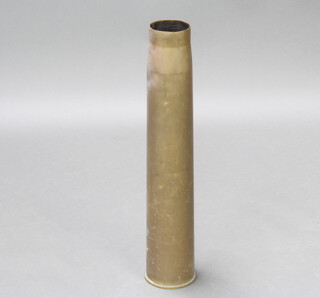 A large brass shell case, base marked 1939, 67cm h x 13cm diam. 