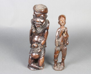 A Continental carved hardwood figure of a standing gentleman 56cm h x 15cm w x 14cm d (slight chips to base) together with 1 other of a fisherman 45cm x 9cm x 10cm 