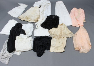 A white cotton night dress, a starched white cotton apron and other items of clothing 