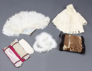 An Irmin stole, a fur muff, an ostrich feather and mother of pearl fan (f) and a red leather glove case containing various gloves 