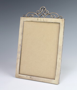 A Victorian rectangular silver photograph frame with wire work crest, monogrammed BCL, London 1897, 23cm x 18cm 