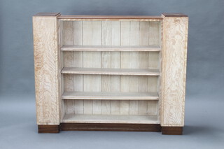 An Art Deco walnut and limed oak bookcase fitted adjustable shelves 116cm h x 141cm w x 29cm d 