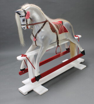 A dappled grey rocking horse 115cm h x 130cm w x 43cm d 