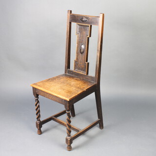 A 1920's Art Nouveau style oak slat and bar back hall chair raised on spiral turned supports with H framed stretcher 