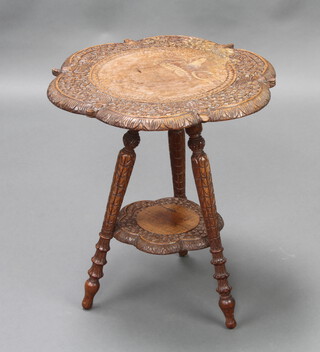 A circular carved Eastern hardwood 2 tier occasional table 51cm h x 45cm diam. (glue stuck to top) 