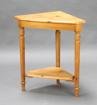 A pine 2 tier corner table raised on turned supports 75cm h x 69cm w x 42cm d 