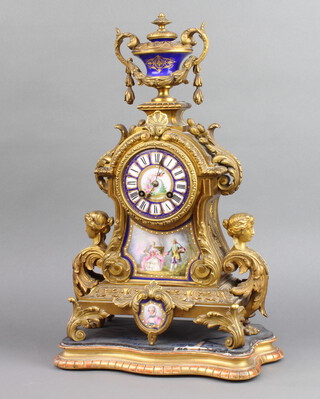 Japy Freres, a French 19th Century 8 day striking mantel clock, the back place marked Japy Freres GF762, contained in a gilt ormolu and porcelain case and panels surmounted by a lidded urn complete with pendulum 