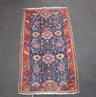 A red and blue ground Caucasian style rug 197cm x 110cm 