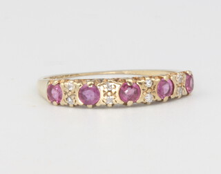 A 9ct yellow gold ruby and diamond ring, 1.1 grams, size K 