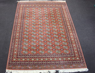 Wilton, a Nazareth Salome Rug, heavy duty machine made brown, black and white ground Bokhara style carpet with 90 octagons to the centre 340cm x 249cm
