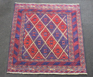 A red and blue ground Gazak rug with all over geometric design 125cm x 123cm 