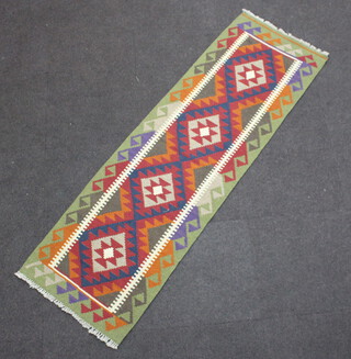 A green, tan and brown ground Maimana Kilim runner with 4 diamonds to the centre 198cm x 60cm 