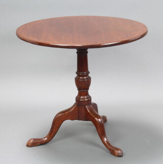 A Georgian circular mahogany snap top tea table raised on a turned column and tripod base 72cm h x 73 cm diam. 