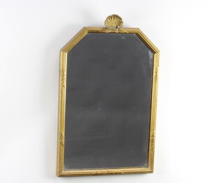 A Georgian style shaped plate wall mirror contained in a decorative gilt frame surmounted by a shell 52cm h x 33cm d 
