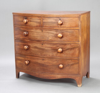 A Georgian mahogany bow front chest of 2 short and 3 long drawers with tore handles, raised on bracket feet 102cm h x 107cm w x 54cm d 