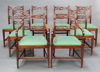 A set of 8 Georgian style mahogany bar back dining chairs with pierced mid rails, upholstered drop in seats raised on square tapered supports with H framed stretcher 