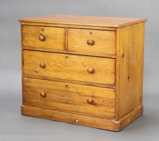 A Victorian pine chest of 2 short and 2 long drawers with brass escutcheons and replacement tore handles, raised on a platform base 78cm h x 88cm w x 53cm d 