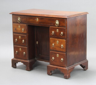 A Georgian mahogany dressing table fitted 1 long drawer, the pedestal fitted a cupboard enclosed by a panelled door and flanked by 6 short drawers 77cm h x 93cm w x 50cm d 