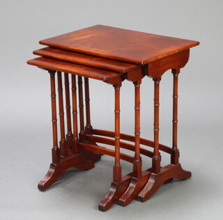 A nest of 3 rectangular Georgian style crossbanded mahogany interfitting coffee tables on turned supports 56cm h x 51cm w x 36cm d 
