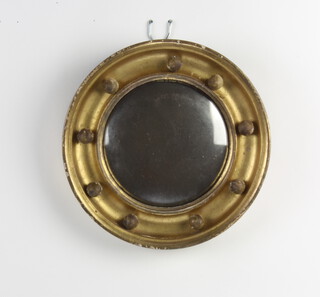 A 19th Century circular convex plate mirror contained in a gilt ball studded frame 20cm diam. 