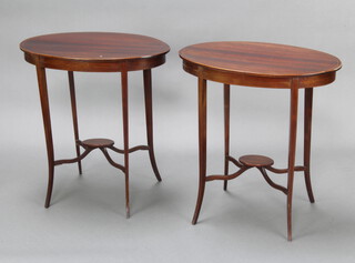 A pair of Edwardian oval inlaid mahogany 2 tier occasional tables, raised on outswept supports 72cm h x 68cm w x 41cm d 