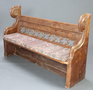 A Victorian Gothic style carved and pierced pine pew with raised back 203cm h x 164cm w x 44cm d 