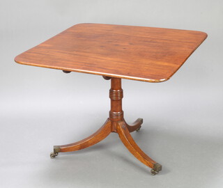 A Georgian mahogany rectangular breakfast table raised on a turned column and tripod base ending in brass caps and castors 68cm h x 91cm w x 90cm d 