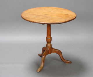 A Georgian light oak snap top tea table raised on a turned column and tripod base 67cm h x 68cm w 
