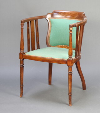 An Edwardian inlaid mahogany tub back chair with upholstered seat and back, raised on turned supports