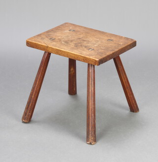A 19th Century rectangular elm rustic stool raised on outswept supports 32cm h x 33cm w x 26cm d 