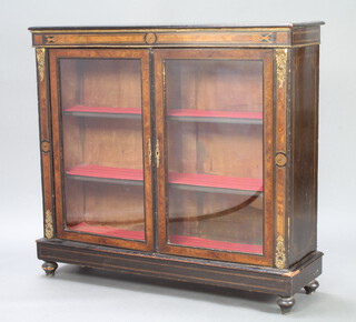 A Victorian ebonised and figured walnut display cabinet, fitted shelves and having gilt metal mounts throughout, raised on bun feet 106cm h x 115cm w x 34cm d 